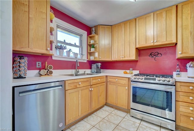 kitchen with light brown cabinetry, sink, light tile patterned flooring, and stainless steel appliances