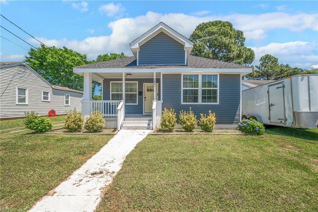 bungalow-style house featuring a front yard and a porch