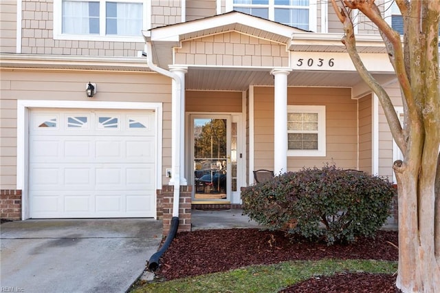 doorway to property featuring a garage