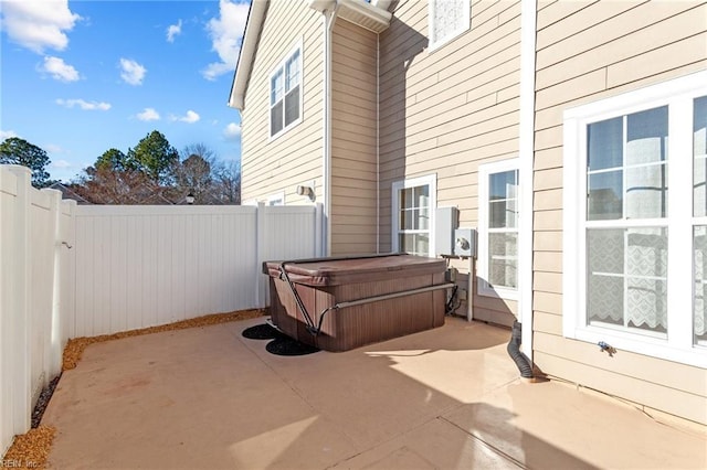 view of patio / terrace featuring a hot tub