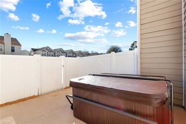 view of patio / terrace with a hot tub