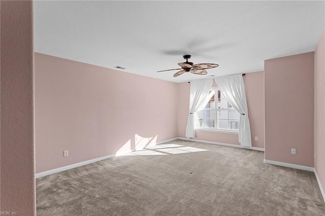 carpeted empty room with ceiling fan