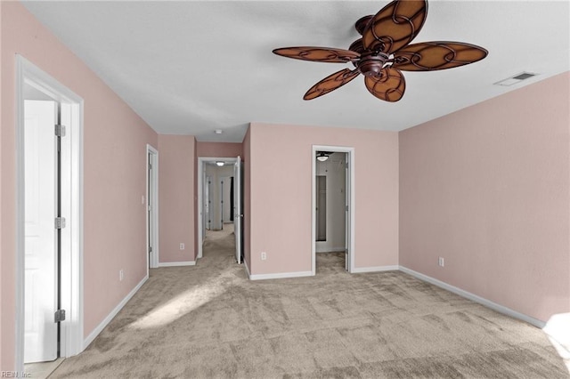 unfurnished bedroom featuring ceiling fan and light carpet