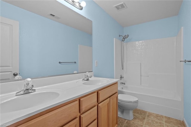 full bathroom featuring vanity, shower / bathing tub combination, and toilet