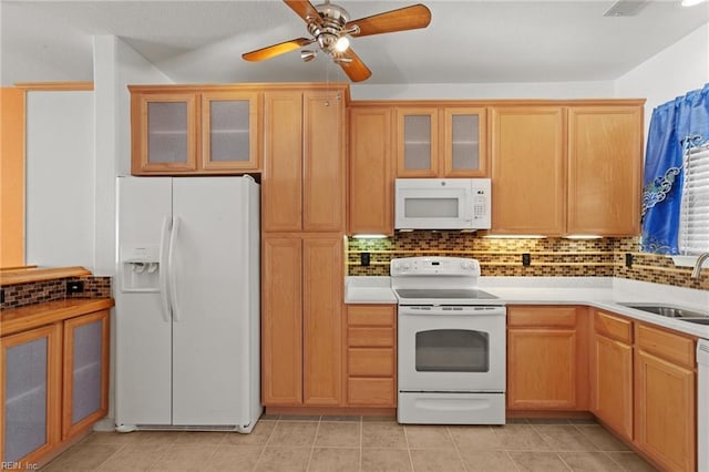 kitchen featuring ceiling fan, sink, white appliances, decorative backsplash, and light tile patterned floors