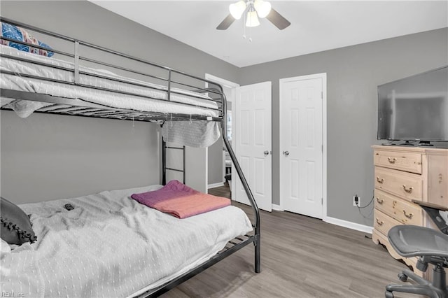 bedroom featuring ceiling fan and hardwood / wood-style floors