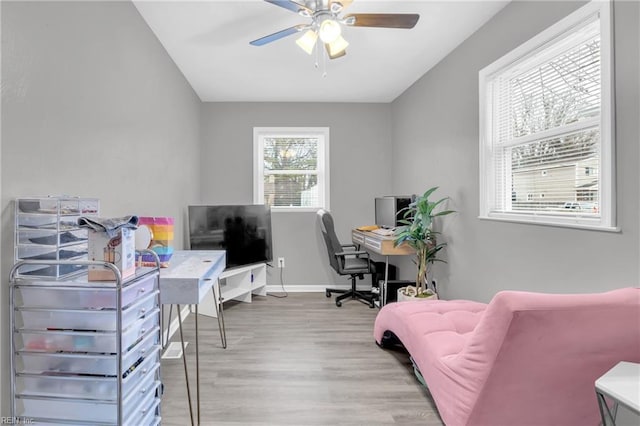 office area with ceiling fan and light hardwood / wood-style floors