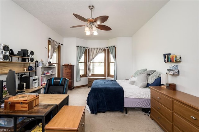 bedroom with light colored carpet and ceiling fan