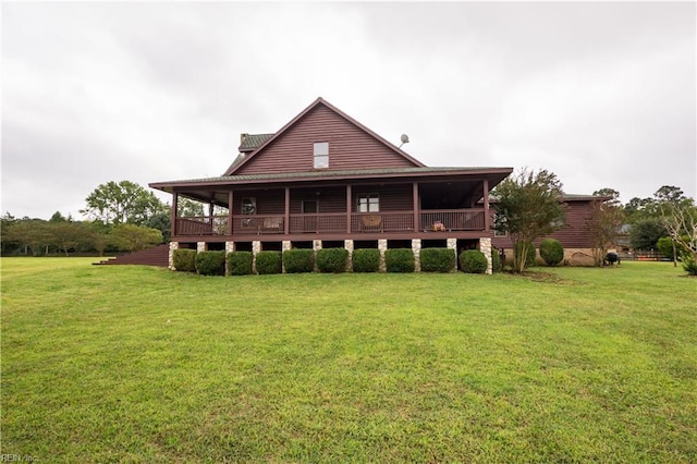 rear view of house with a lawn