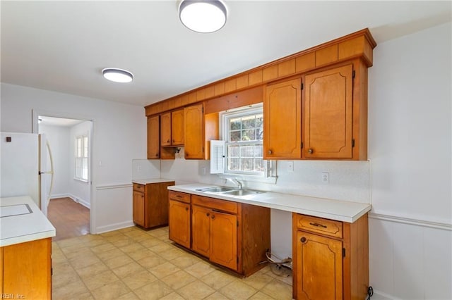 kitchen with white refrigerator and sink