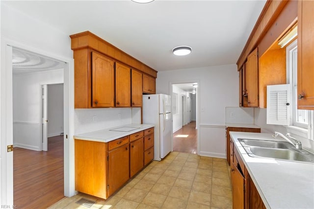 kitchen with white fridge and sink