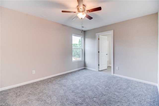 unfurnished room featuring carpet flooring and ceiling fan