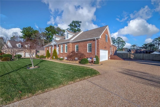 view of front of home with a garage and a front lawn