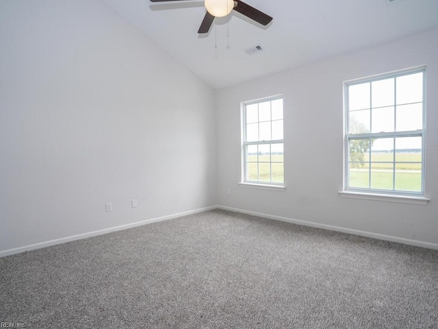 empty room featuring carpet flooring, ceiling fan, and lofted ceiling