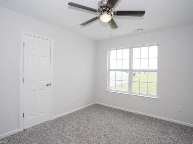 unfurnished room with carpet floors and ceiling fan