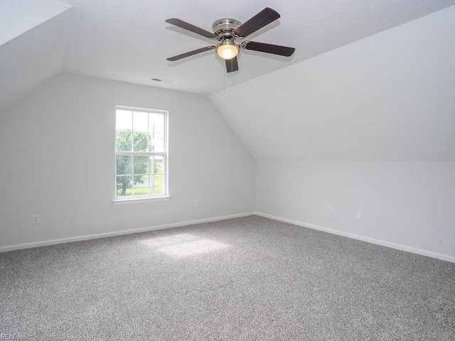 bonus room with ceiling fan, carpet, and vaulted ceiling