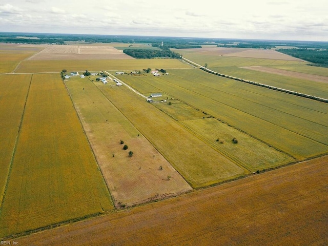 birds eye view of property with a rural view