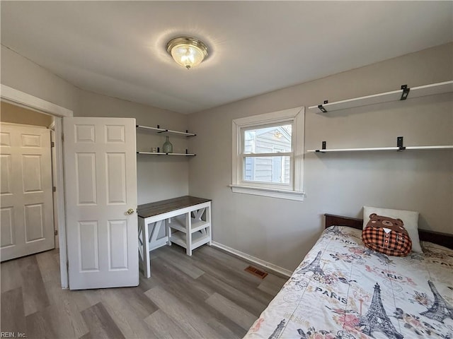 bedroom featuring hardwood / wood-style flooring