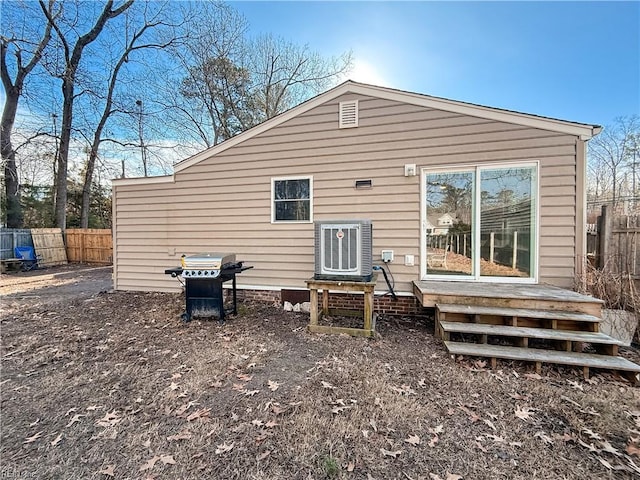 rear view of property featuring central AC