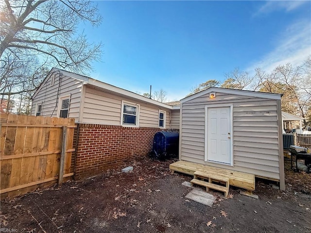 back of property with a shed