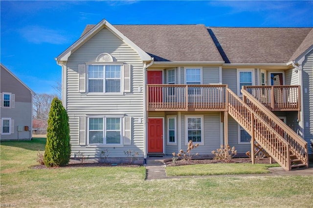 view of property featuring a front lawn