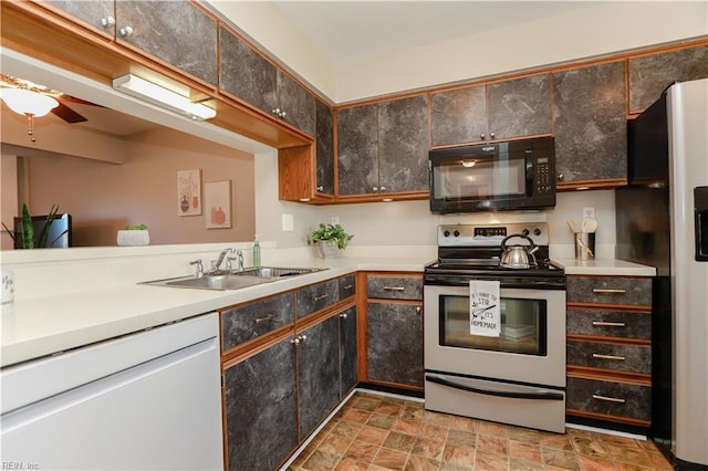 kitchen with ceiling fan, sink, and white appliances