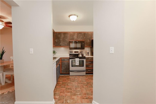 kitchen with dark brown cabinetry, ceiling fan, and stainless steel range with electric cooktop