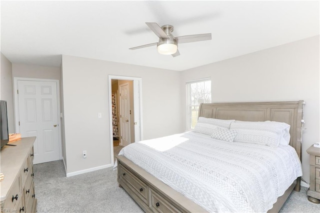 bedroom with light colored carpet and ceiling fan