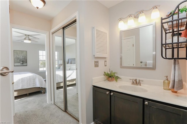 bathroom featuring ceiling fan and vanity