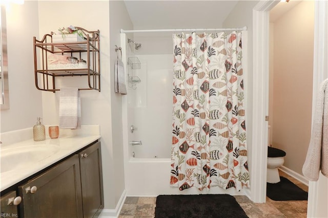 full bathroom featuring vanity, toilet, and shower / bath combo with shower curtain