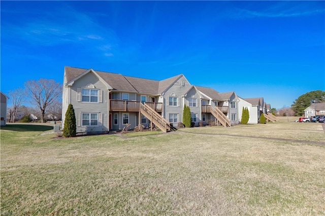 exterior space with a front lawn and a deck