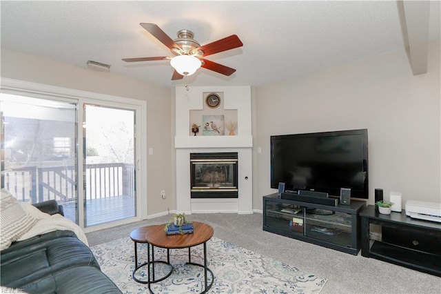 living room with light carpet and ceiling fan