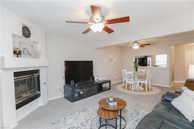 living room with carpet floors and ceiling fan