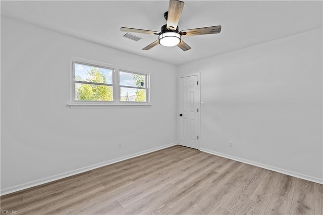 unfurnished room featuring ceiling fan and light hardwood / wood-style flooring