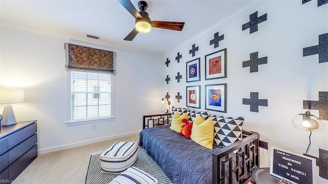 carpeted bedroom with crown molding and ceiling fan