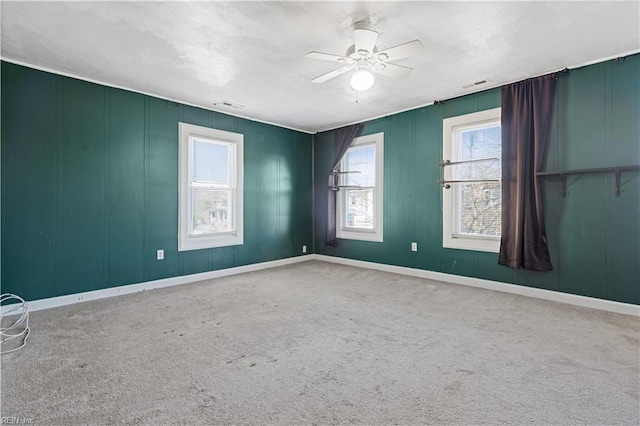 unfurnished room featuring carpet and ceiling fan