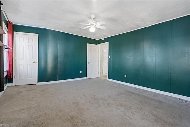 unfurnished bedroom featuring carpet and ceiling fan