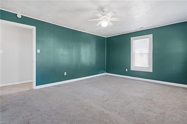 unfurnished room with carpet floors and ceiling fan