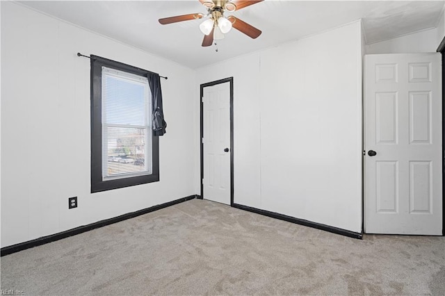 unfurnished bedroom with light carpet and ceiling fan