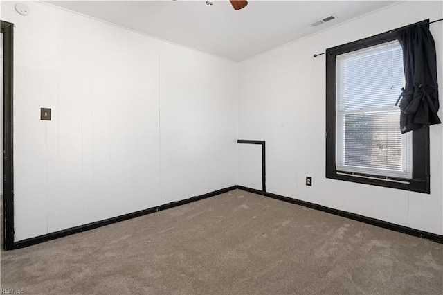 carpeted empty room with ceiling fan