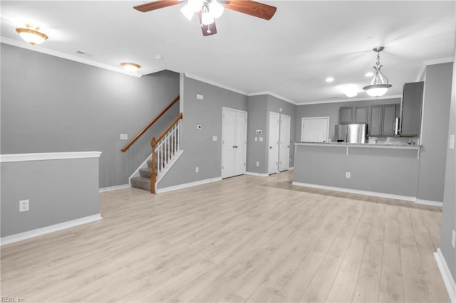 unfurnished living room with ceiling fan, crown molding, and light hardwood / wood-style flooring