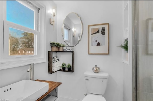 bathroom with toilet and sink