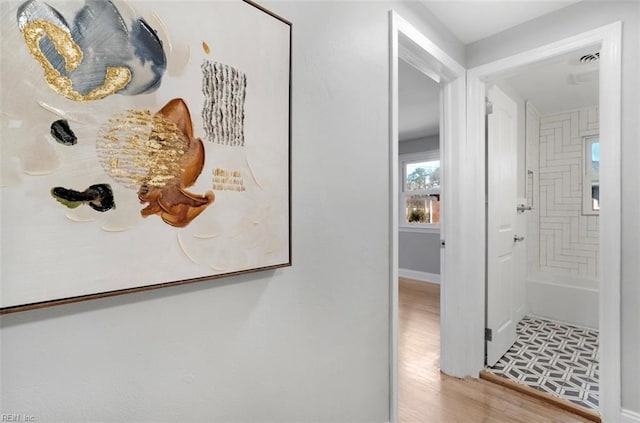 hallway featuring light hardwood / wood-style floors