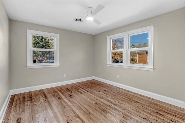 spare room featuring ceiling fan and light hardwood / wood-style floors