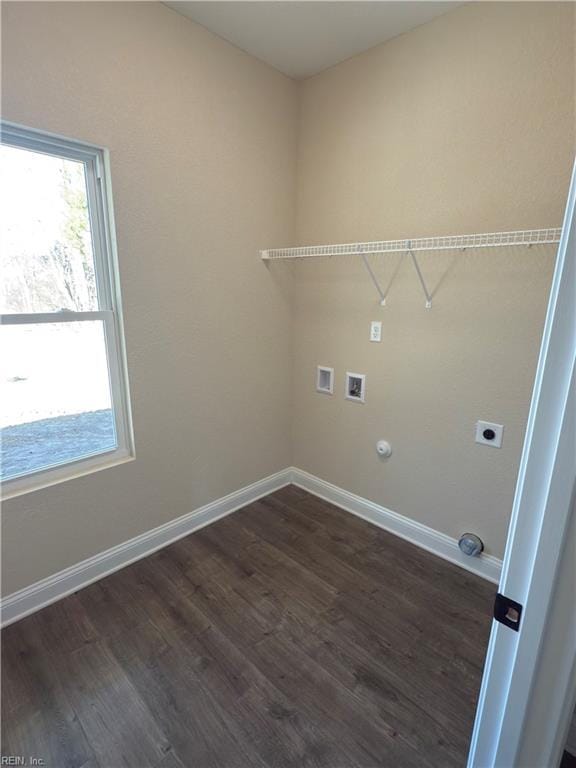 washroom featuring electric dryer hookup, plenty of natural light, dark hardwood / wood-style floors, and hookup for a washing machine