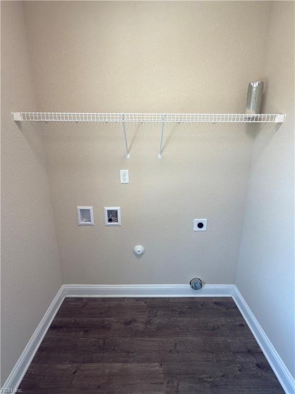 washroom featuring electric dryer hookup, dark hardwood / wood-style floors, hookup for a gas dryer, and hookup for a washing machine