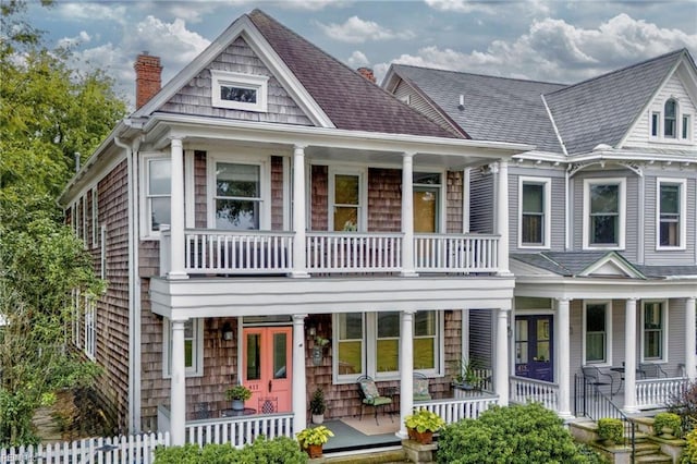 view of front of home with a balcony and a porch