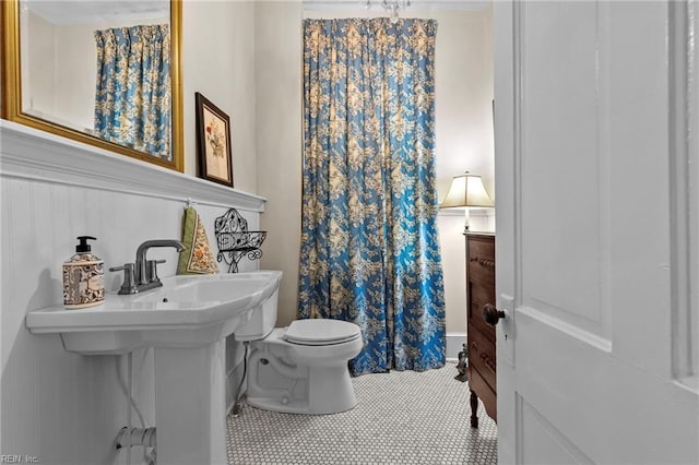 bathroom with tile patterned flooring and toilet