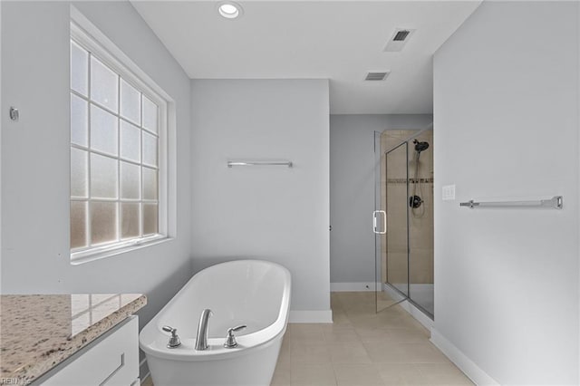 bathroom featuring plus walk in shower and a wealth of natural light