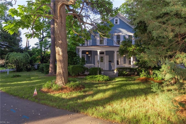 view of front of house featuring a porch and a front lawn